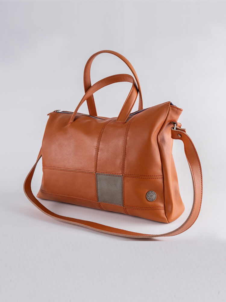 The Mondrian, MakladWali's genuine leather handbag can be carried around your wrist or as a shoulder bag.
